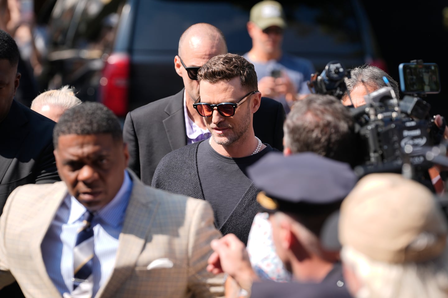 Justin Timberlake, center, walked into court for his arraignment on Friday in Sag Harbor, N.Y.