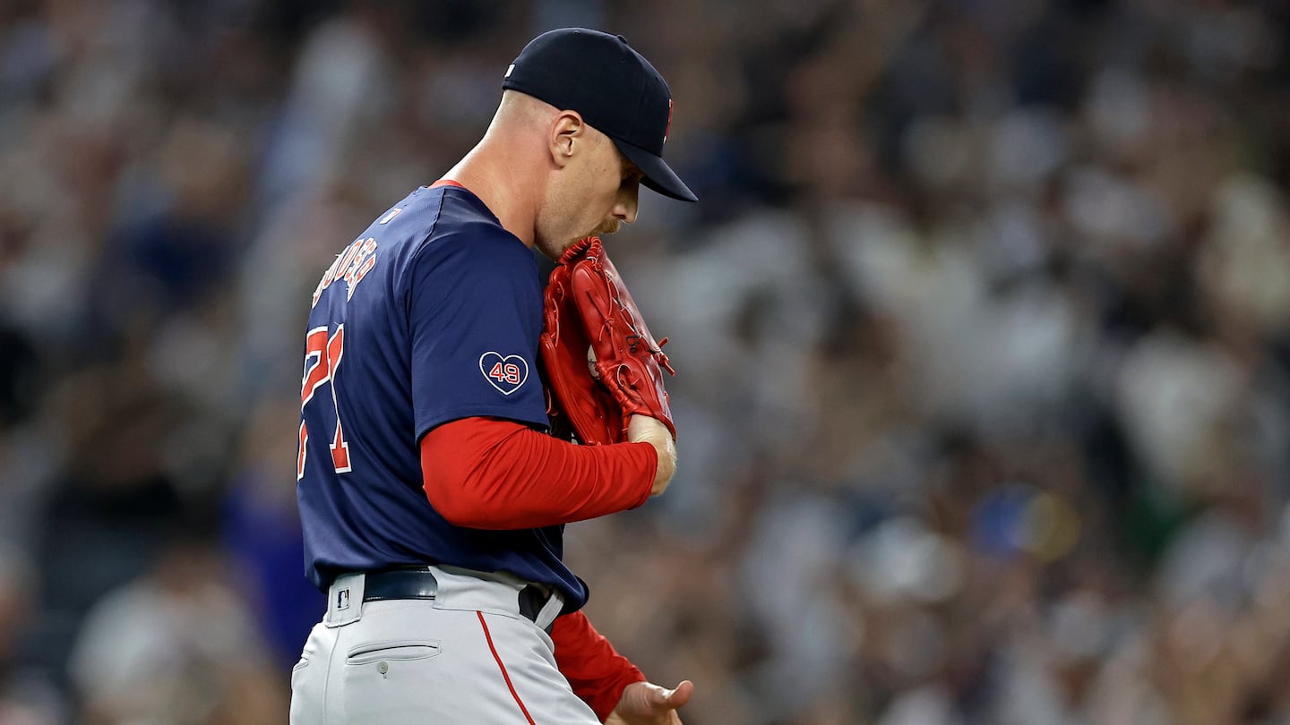 Cam Booser reacts after giving up a grand slam to Aaron Judge during the seventh inning.