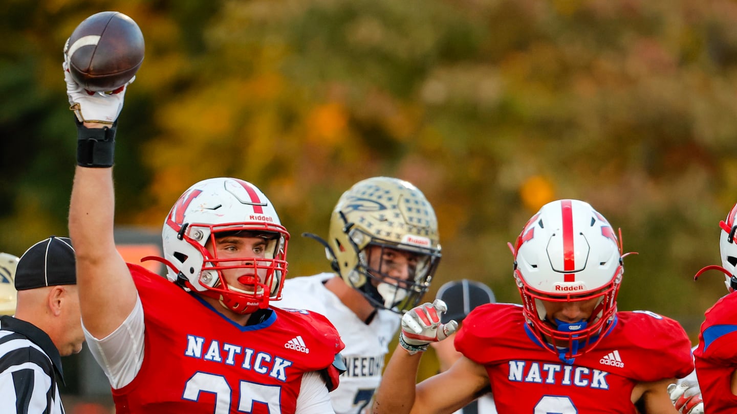 Natick's Jack Kelly recovers a fumble near the goal line against Needham on Friday.