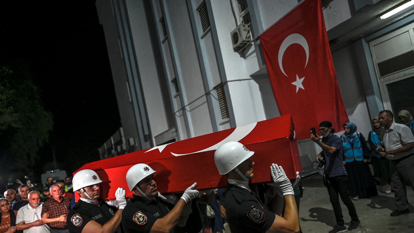 The coffin of US-Turkish activist Aysenur Ezgi Eygi, who was shot dead in the West Bank, is carried by Turkish honor guard police officers to a morgue at the Didim district in Aydin on Sept. 13.