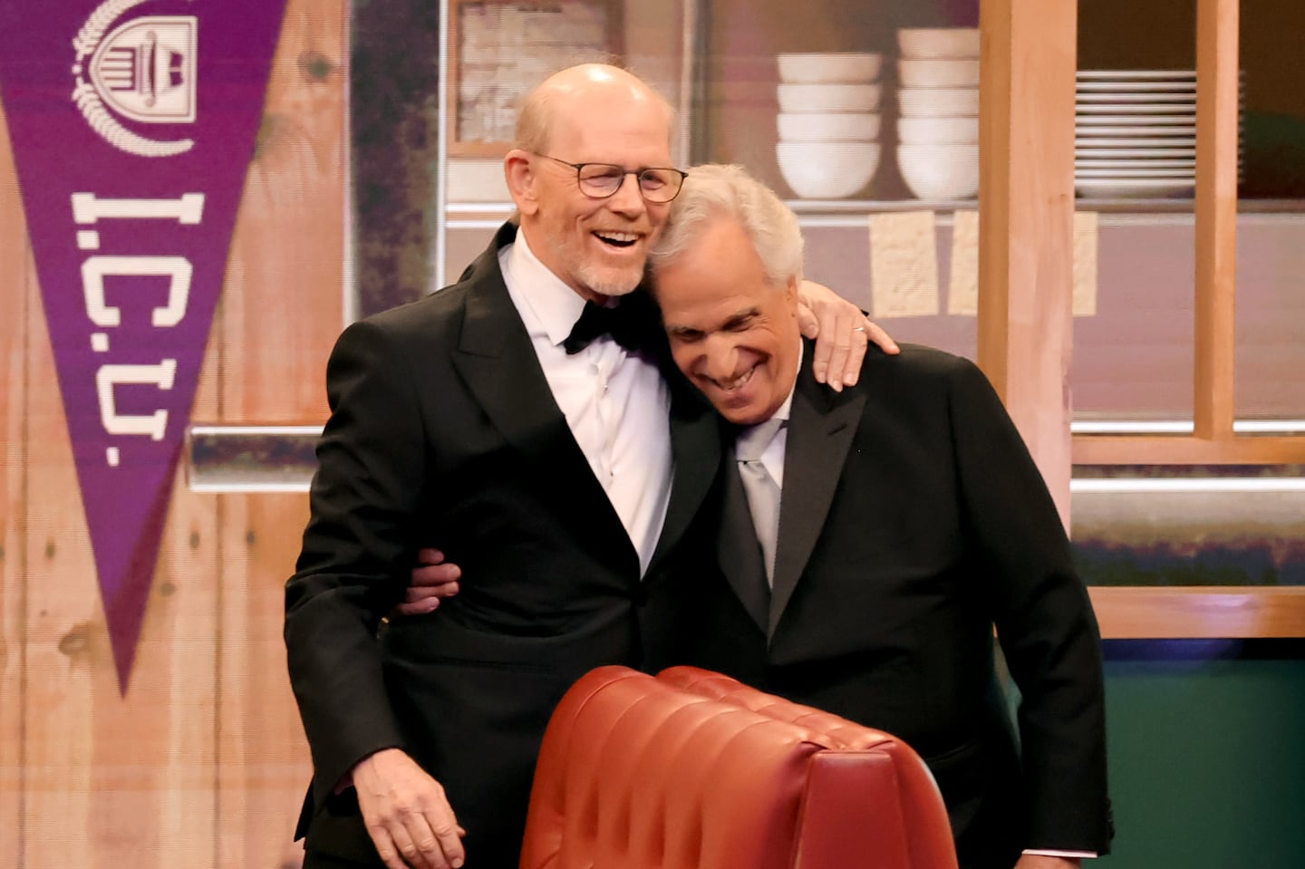 From left: Ron Howard and Henry Winkler spoke onstage during the 76th Primetime Emmy Awards at Peacock Theater on Sunday in Los Angeles.