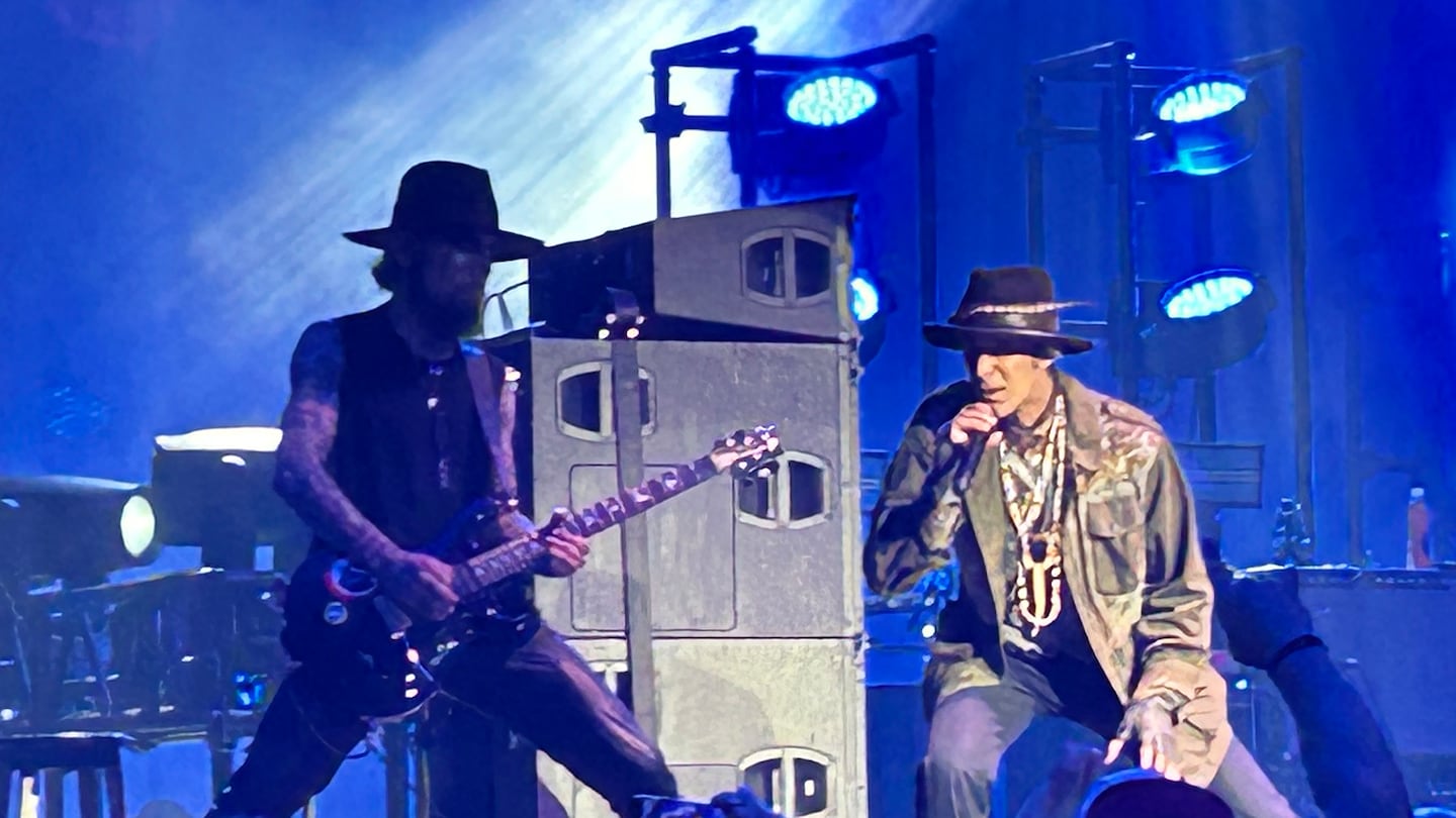 Dave Navarro ( left ) and Perry Farrell during the Jane's Addiction concert at the Leader Bank Pavilion on Friday. The show ended early after Farrell threw a punch at Navarro.