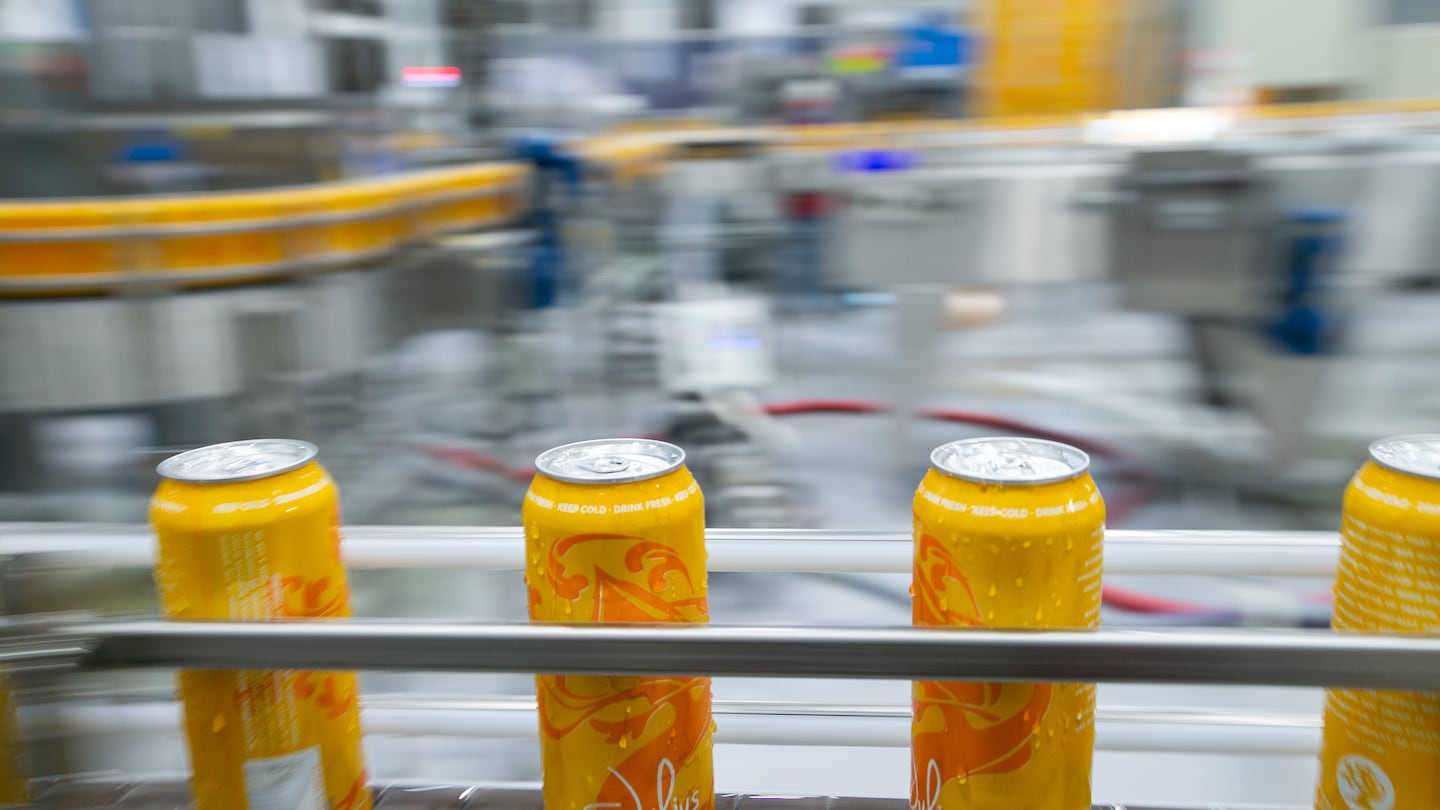 Cans of Tree House Brewing Company's New England IPA Julius make their way down the canning line at the brewery in Charlton,.