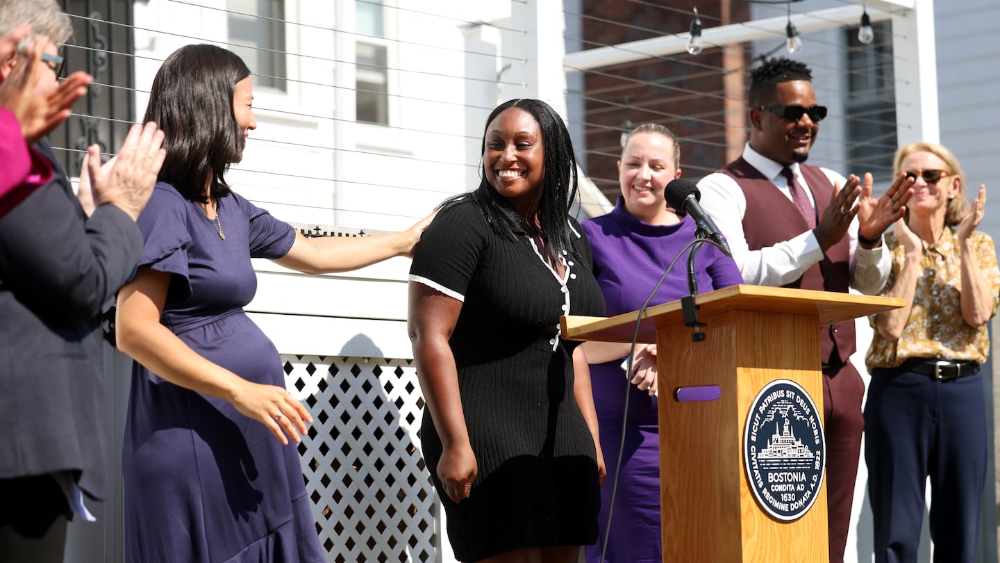 Mayor Michelle Wu congratulated Keanna Rice, a Boston resident who was able to purchase her home with the help of the Boston Housing Authority's First Home Program after she spoke during a news conference held in her backyard.