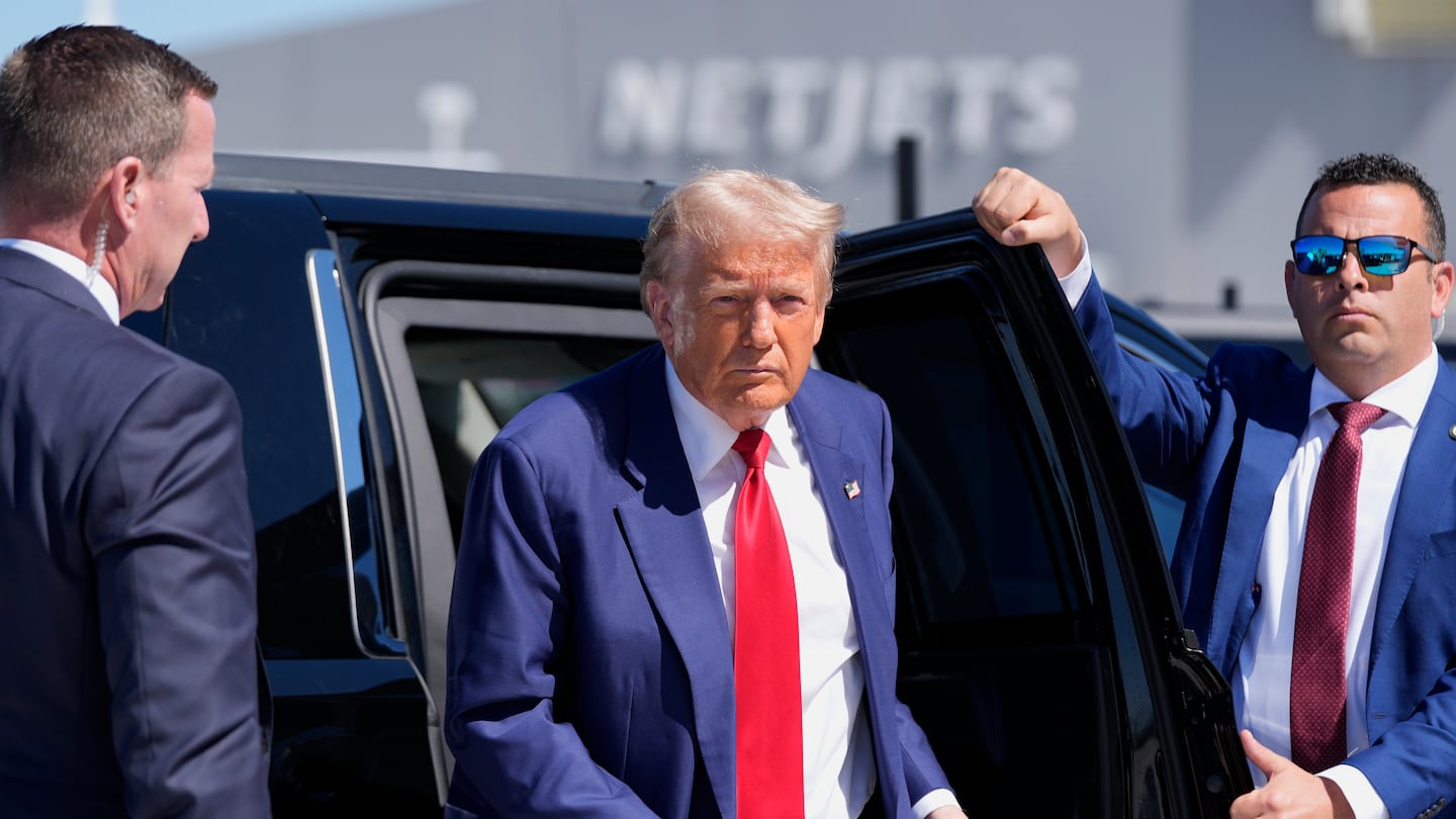 Former president Donald Trump arrives at Harry Reid International Airport to board a plane after a campaign trip, Saturday, Sept. 14, 2024, in Las Vegas.