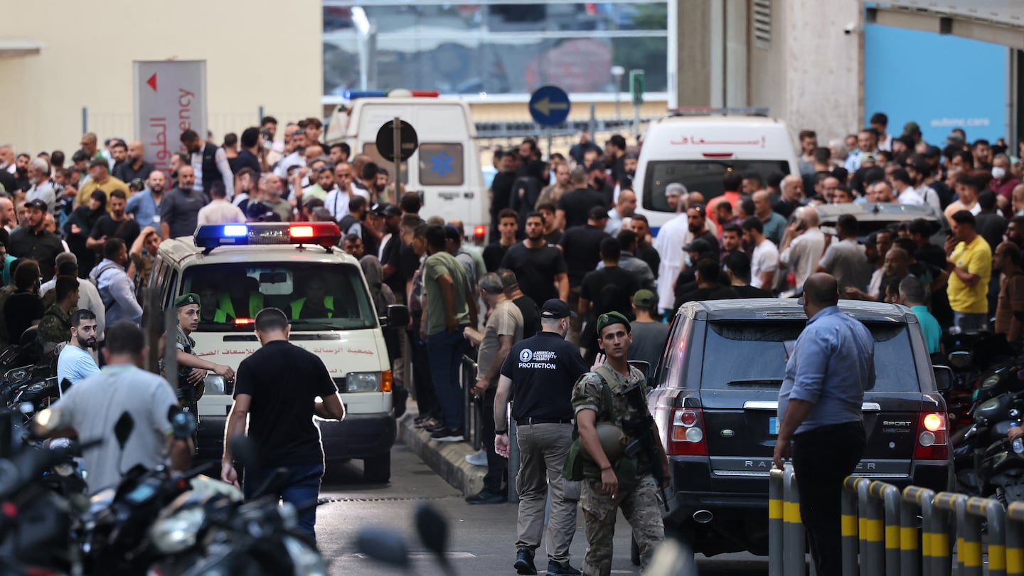 Ambulances were surrounded by people at the entrance of the American University of Beirut Medical Center on Tuesday after explosions hit locations in several Hezbollah strongholds around Lebanon amid ongoing cross-border tensions between Israel and Hezbollah fighters.