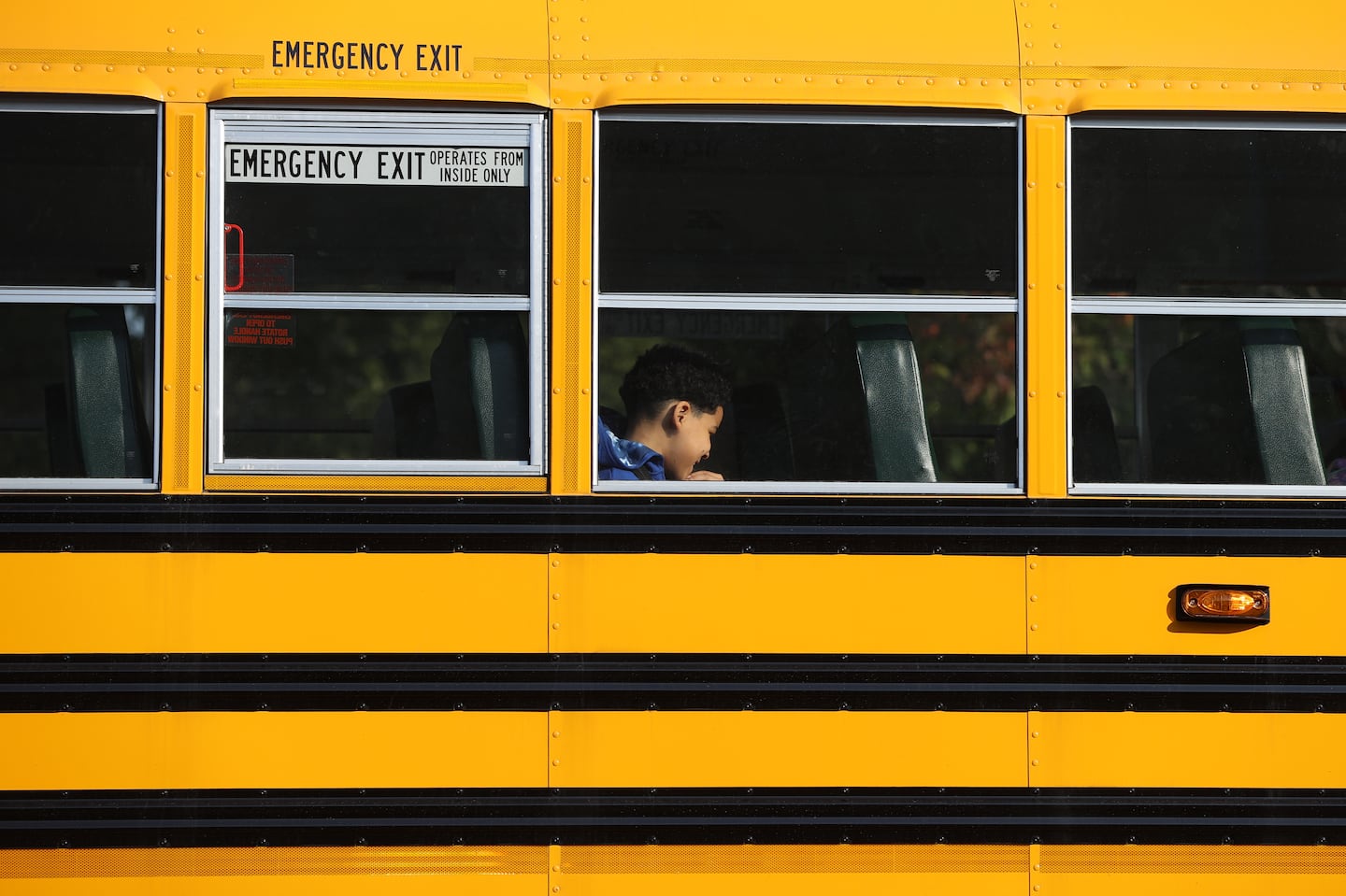 A Boston Public School bus made its way out of the Ruth Batson Academy in Dorchester. Boston Mayor Michelle Wu and Boston School Superintendent Mary Skipper held a morning news conference in the parking lot to address late bus issues.