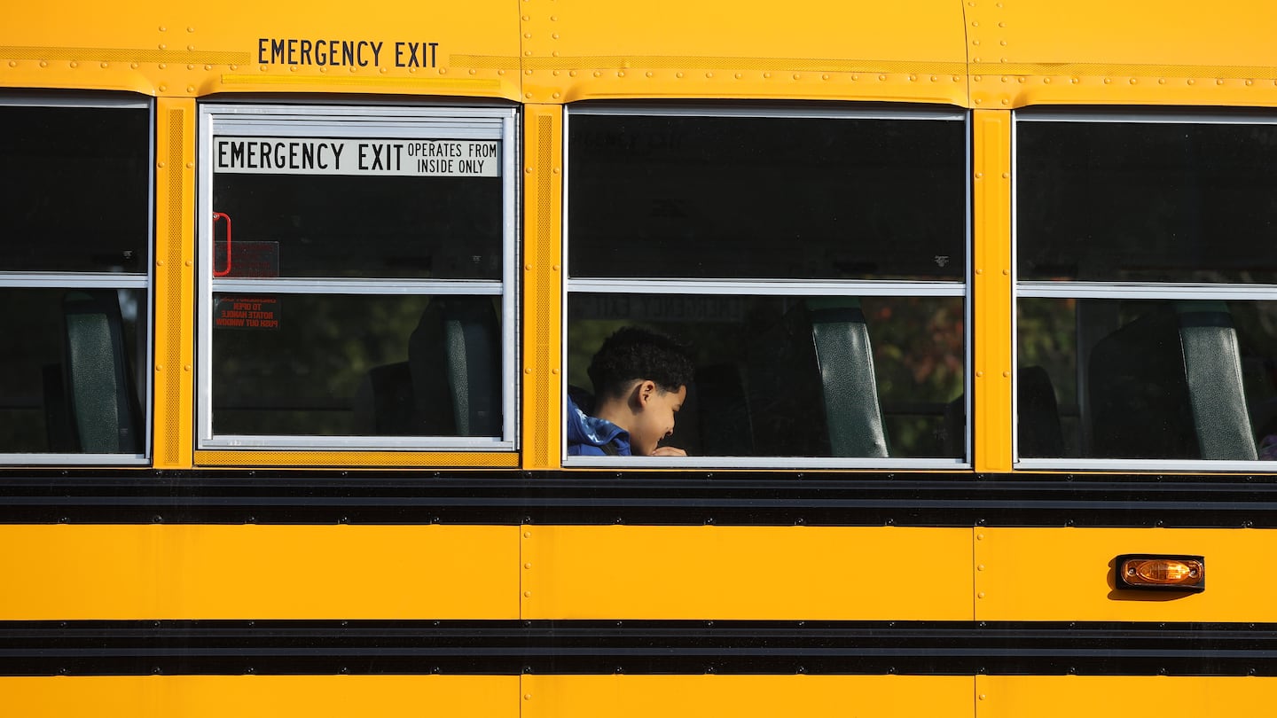 A Boston Public School bus made its way out of the Ruth Batson Academy in Dorchester. Boston Mayor Michelle Wu and Boston School Superintendent Mary Skipper held a morning news conference in the parking lot to address late bus issues.