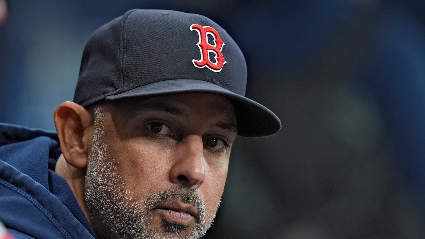 Alex Cora was in his usual spot in the Red Sox dugout for Tuesday's series opener at Tropicana Field.