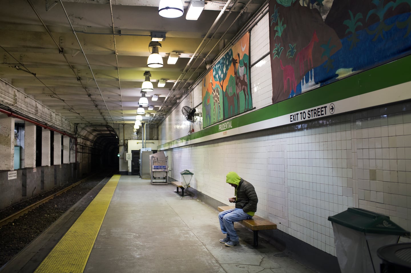 A passenger waits for the train to arrive at Prudential Station late on a Friday night in 2015, when the T experimented with running service until 2 a.m.