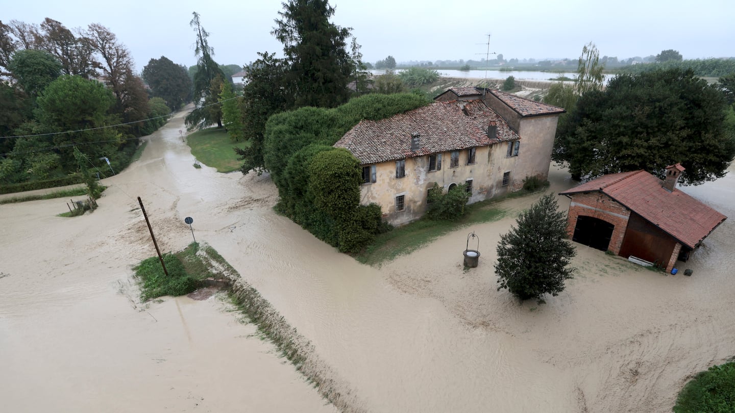 The Lamone river overflows its banks near Bagnacavallo, in the region of Emilia-Romagna, Italy, Thursday, Sept. 19, 2024.