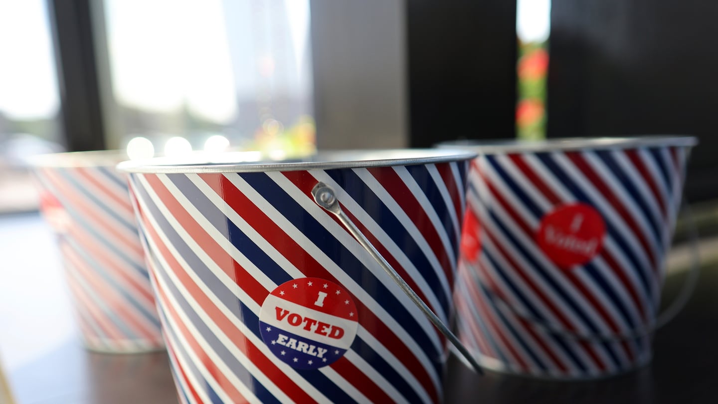 "I Voted Early" stickers sit in a bucket by the ballot box at the City of Minneapolis early voting center, Sept. 19, in St. Paul, Minn.