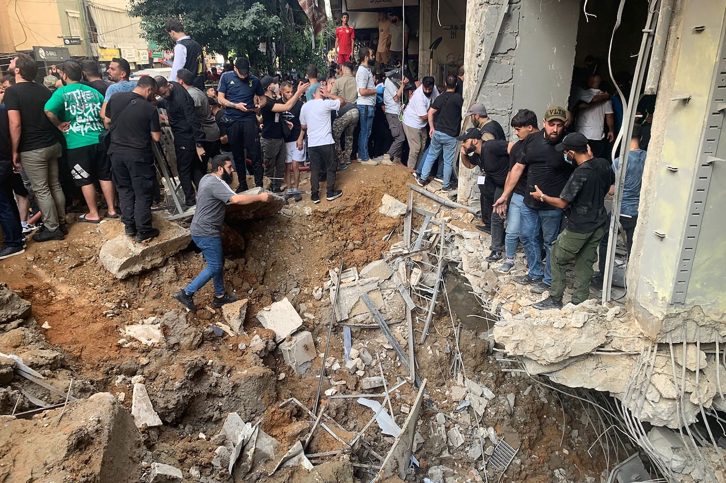 People checked the damage following an Israeli strike in Beirut's southern suburbs on Friday.