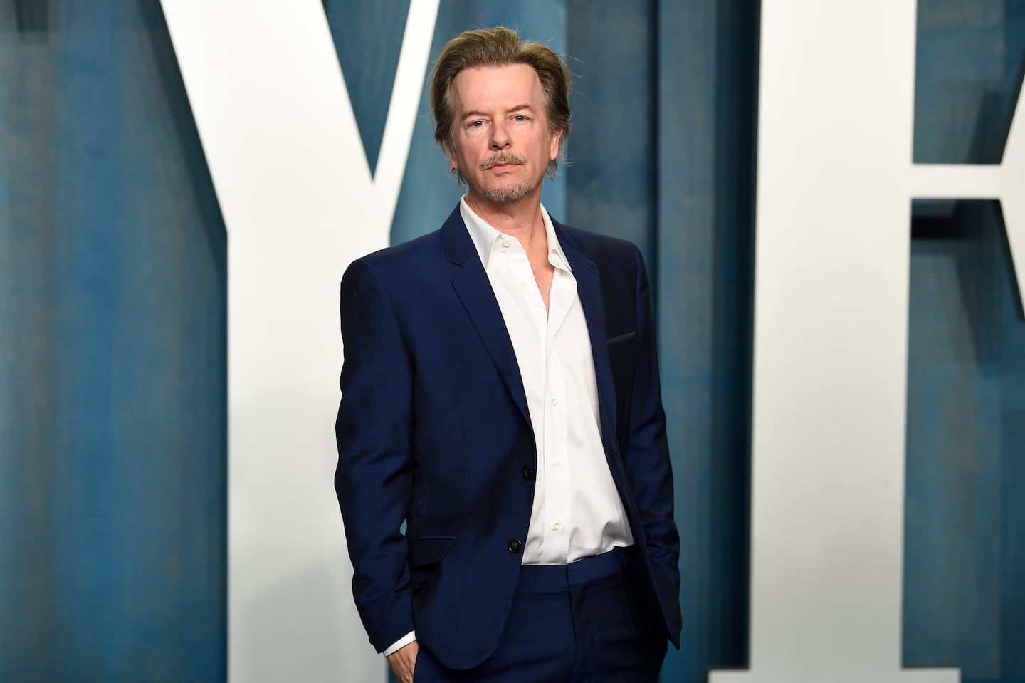 David Spade arrives at the Vanity Fair Oscar Party on March 27, 2022, at the Wallis Annenberg Center for the Performing Arts in Beverly Hills, Calif.