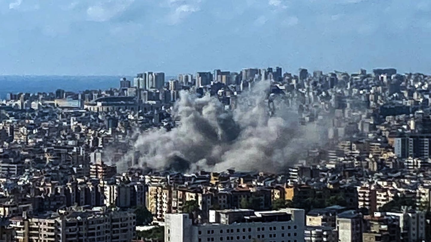 Thick smoke rises above the southern suburbs of Beirut after an Israel strike on Sept. 20.