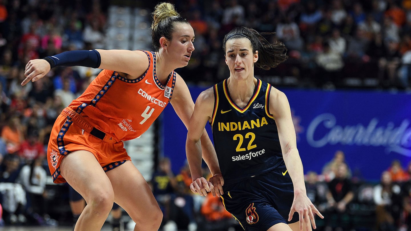 The Sun's Marina Mabrey, who led Connecticut  with 27 points, guards against the Fever's Caitlin Clark during a first-round WNBA playoff game at Mohegan Sun Arena.