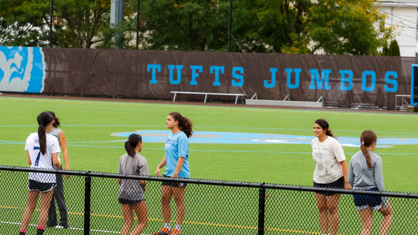 College students playing soccer at the Tufts University athletic fields. On Monday three members of the Tufts University men’s lacrosse team remained hospitalized after participating in a workout led by a graduate who recently completed Navy SEAL training.