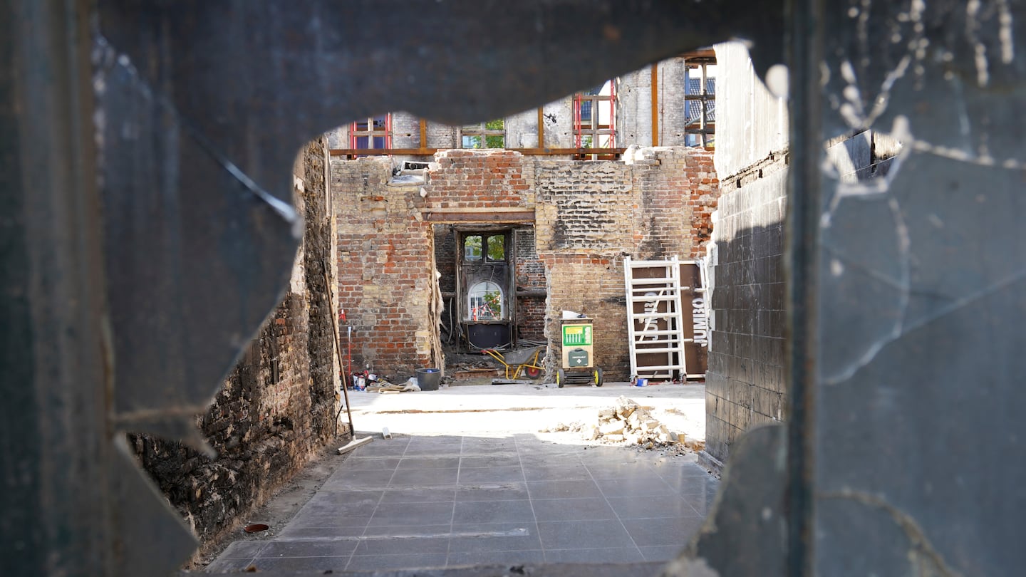 Remains of Copenhagen's Old Stock Exchange building are seen through a broken glass window in Copenhagen, Denmark, on Sept. 19.