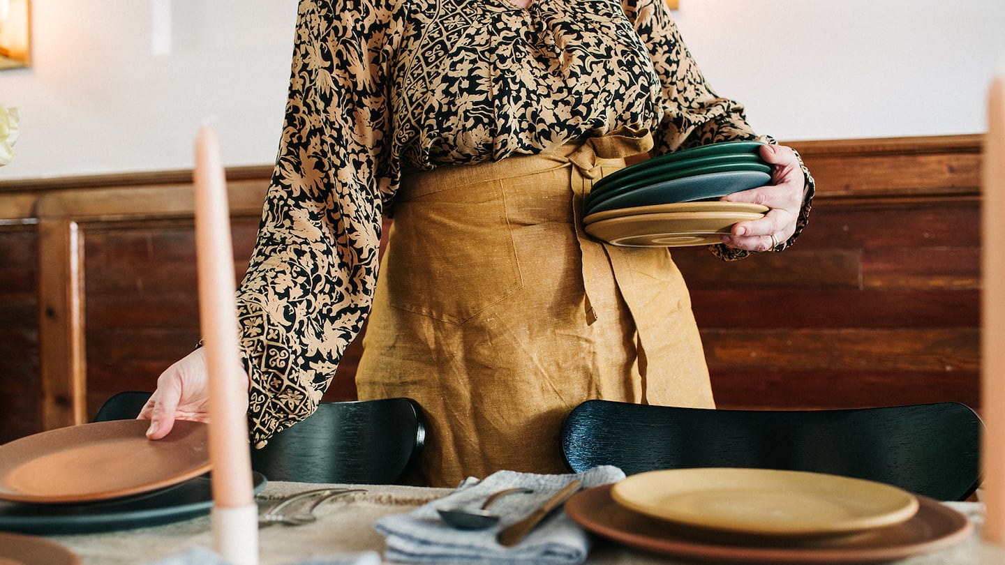 Myrth tableware is set on a table.