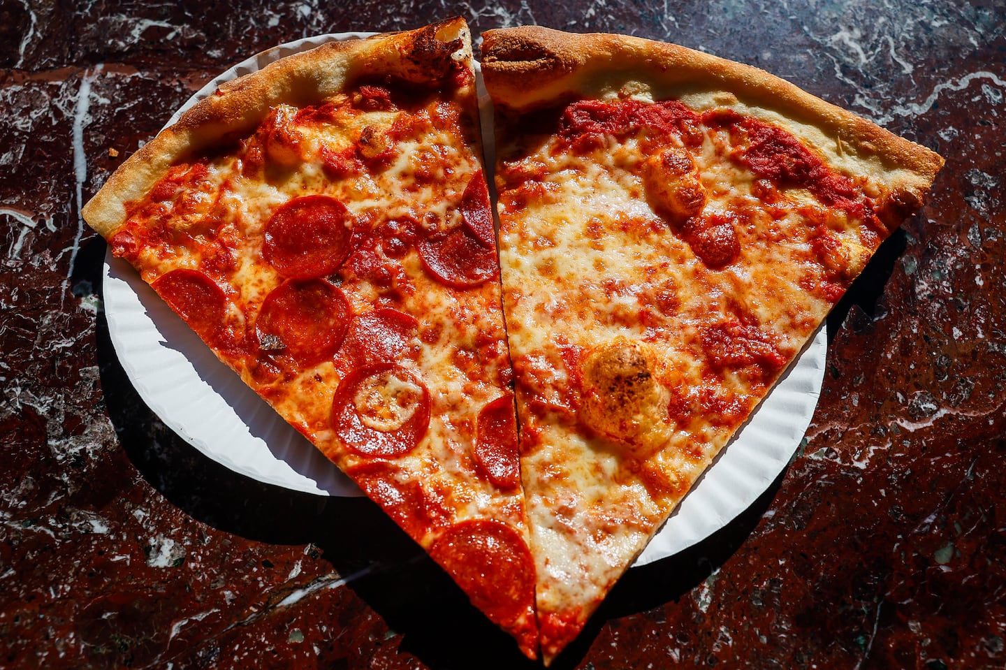 Fresh slices of pepperoni and cheese pizza at Joe’s Pizza in Cambridge.