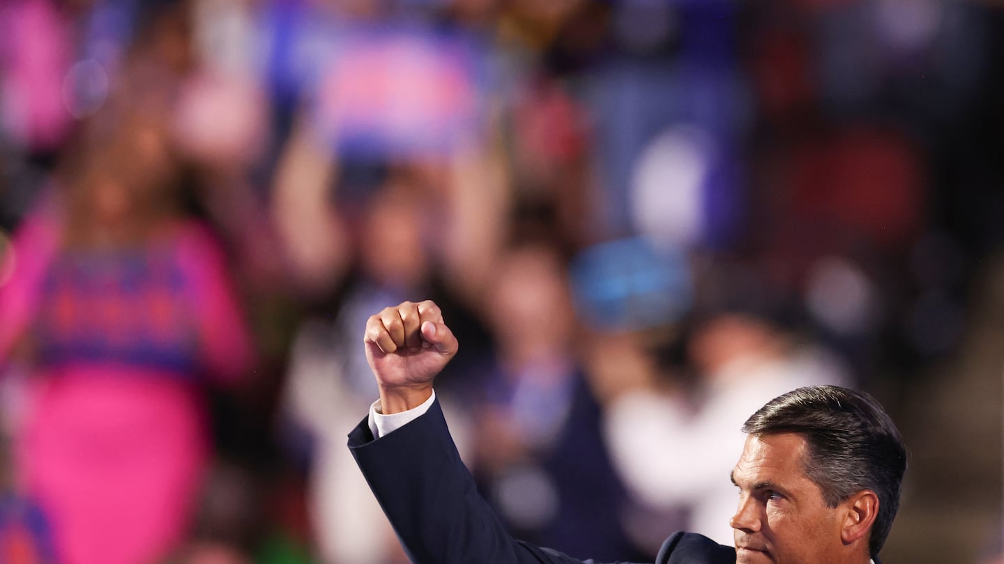 Former Georgia lieutenant governor Geoff Duncan raised his fist after speaking on the third day of the Democratic National Convention in Chicago, on Aug. 21.