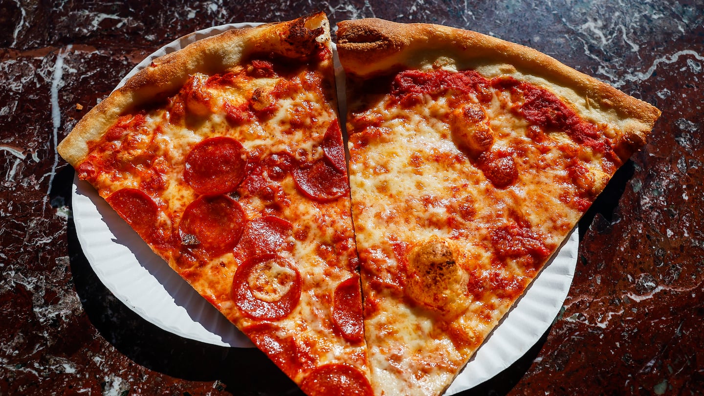 Fresh slices of pepperoni and cheese pizza at Joe’s Pizza in Cambridge.