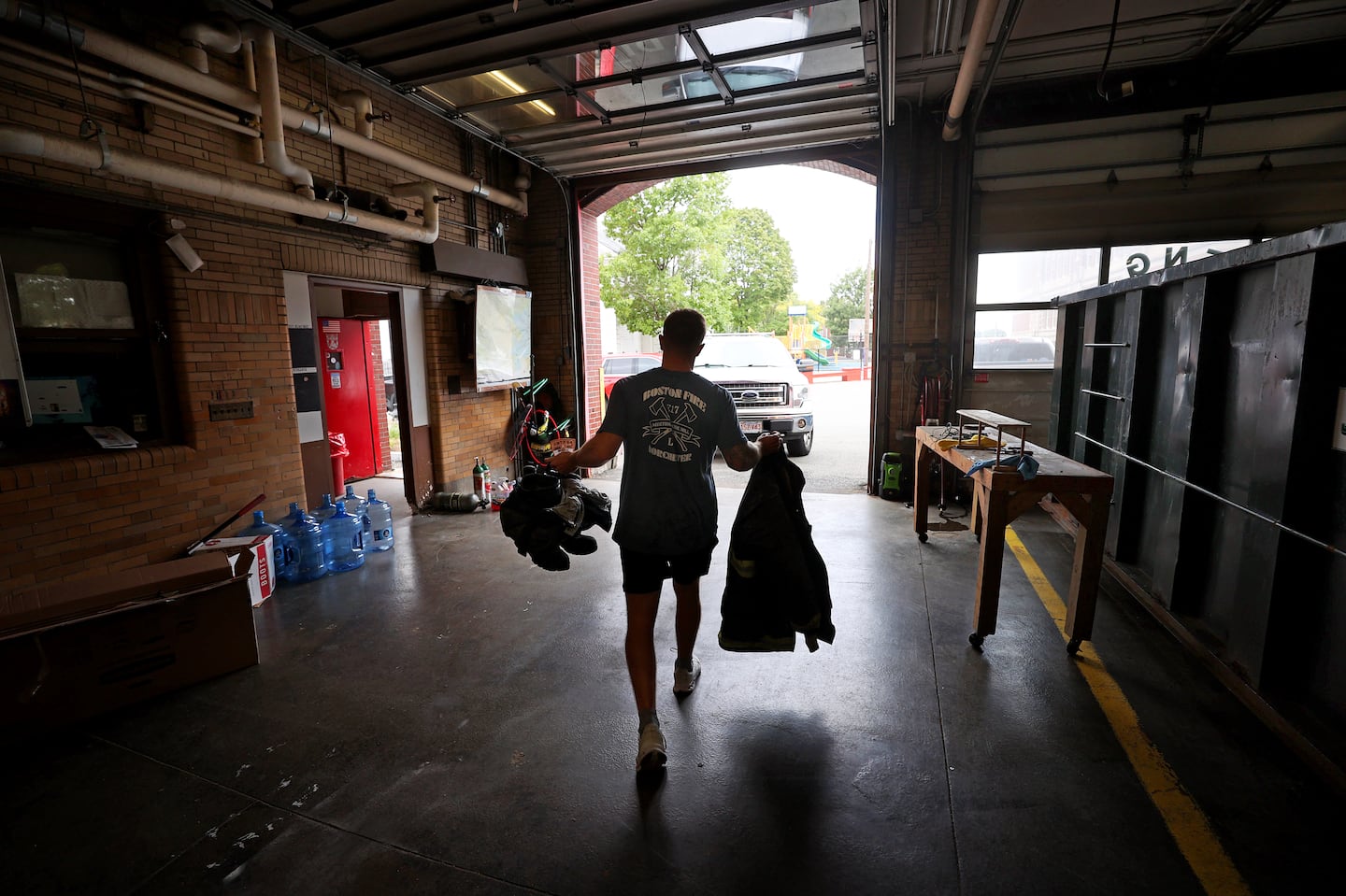 Boston Firefighter Colin Yanovitch, Ladder 17, left the old Dorchester firehouse with his belongings to bring them next door to the new station.