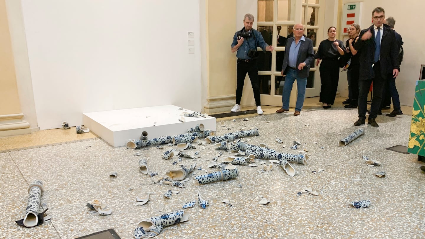 This photo released by OperaLaboratori Tuesday shows the artwork Porcelain Cube by artist Ai Wei Wei destroyed by a Czech man on the day of the opening of the exhibition "Ai Weiwei, Who am I?", at Palazzo Fava, in Bologna, Italy, Friday.