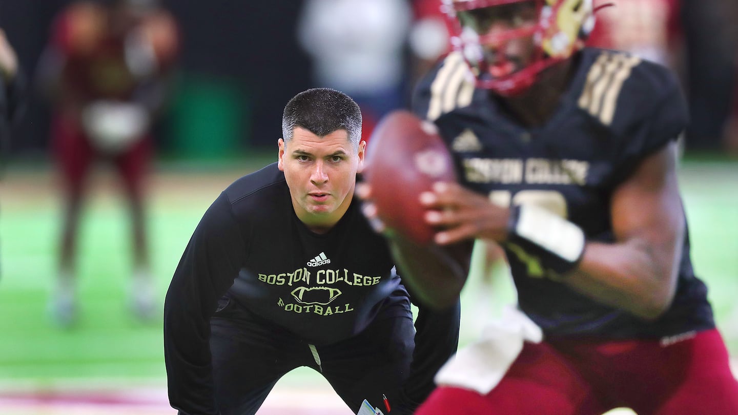 Assistant coach Jonathan DiBiaso keeps a close eye on the quarterbacks for the 3-1 Eagles.