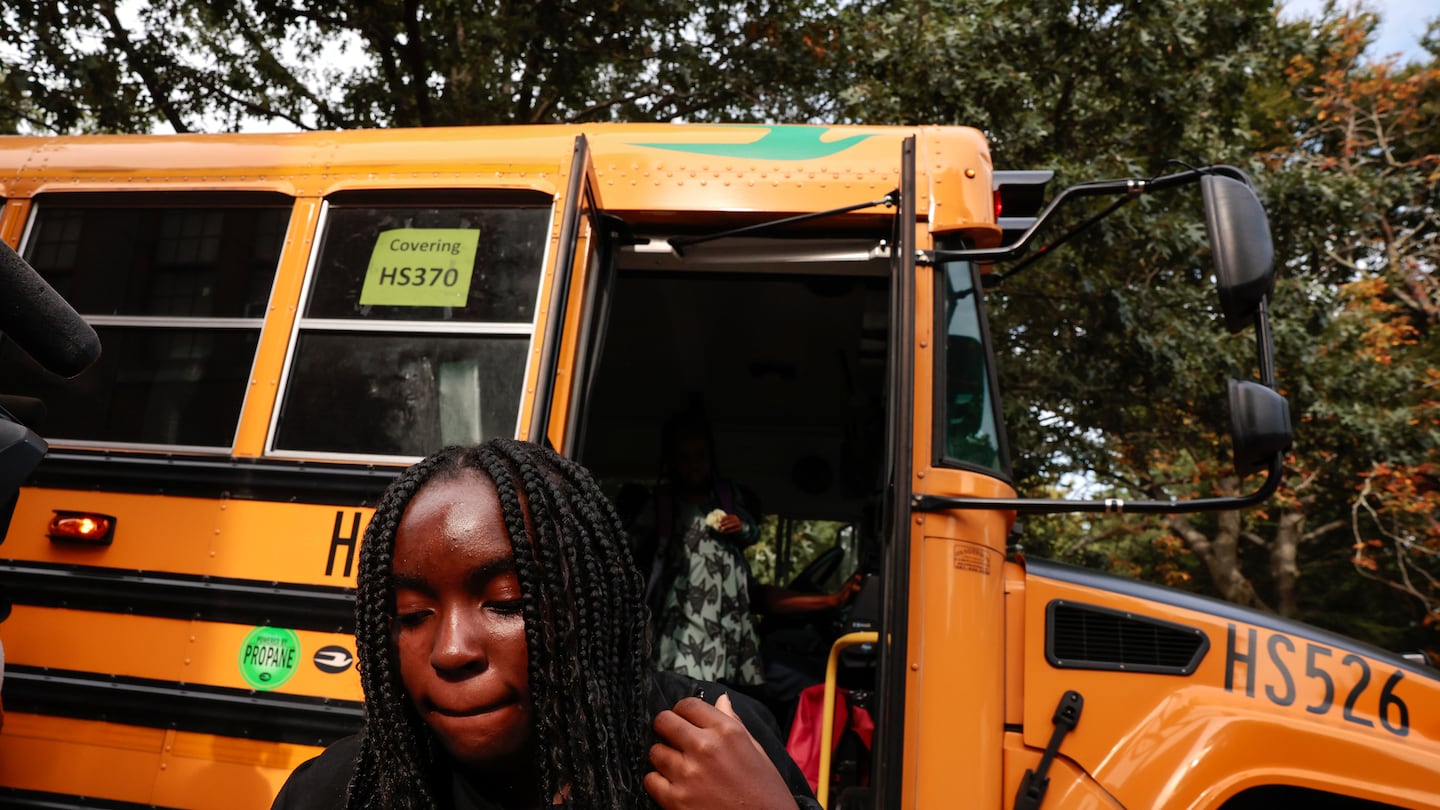 A student disembarked the bus at Higginson-Lewis K-8 School in Boston on Sept. 18.