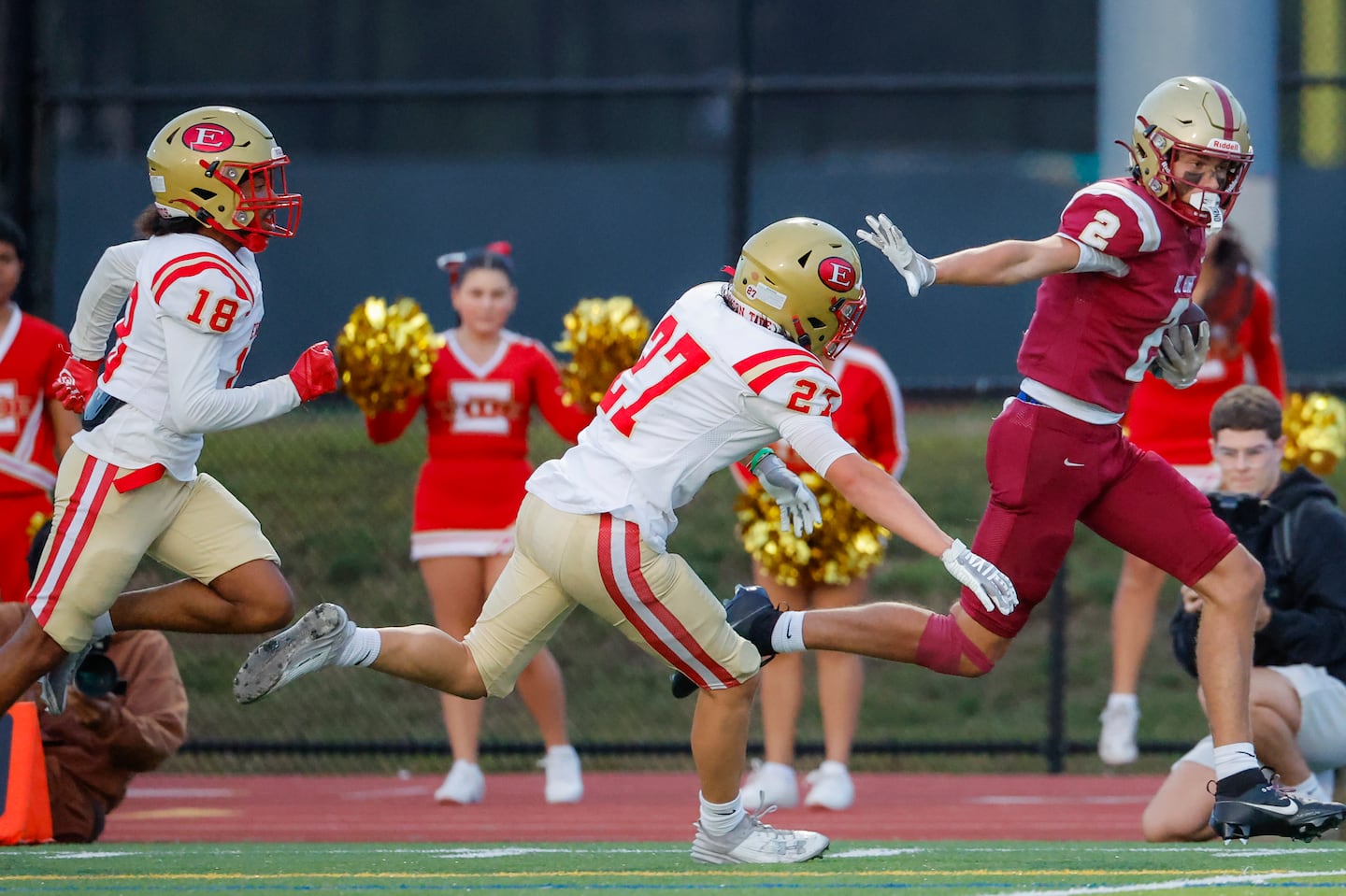 BC High receiver Gavin Barth (2) fends off Everett's Tyler Freni (27) and Chance Barreto (18) on a 29-yard touchdown reception Friday night at James Cotter Field.