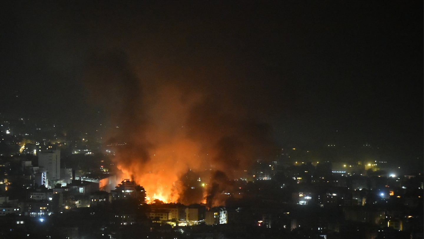 Smoke billows from the site of an Israeli airstrike that targeted a neighborhood in Beirut's southern suburb early on September 28, 2024.