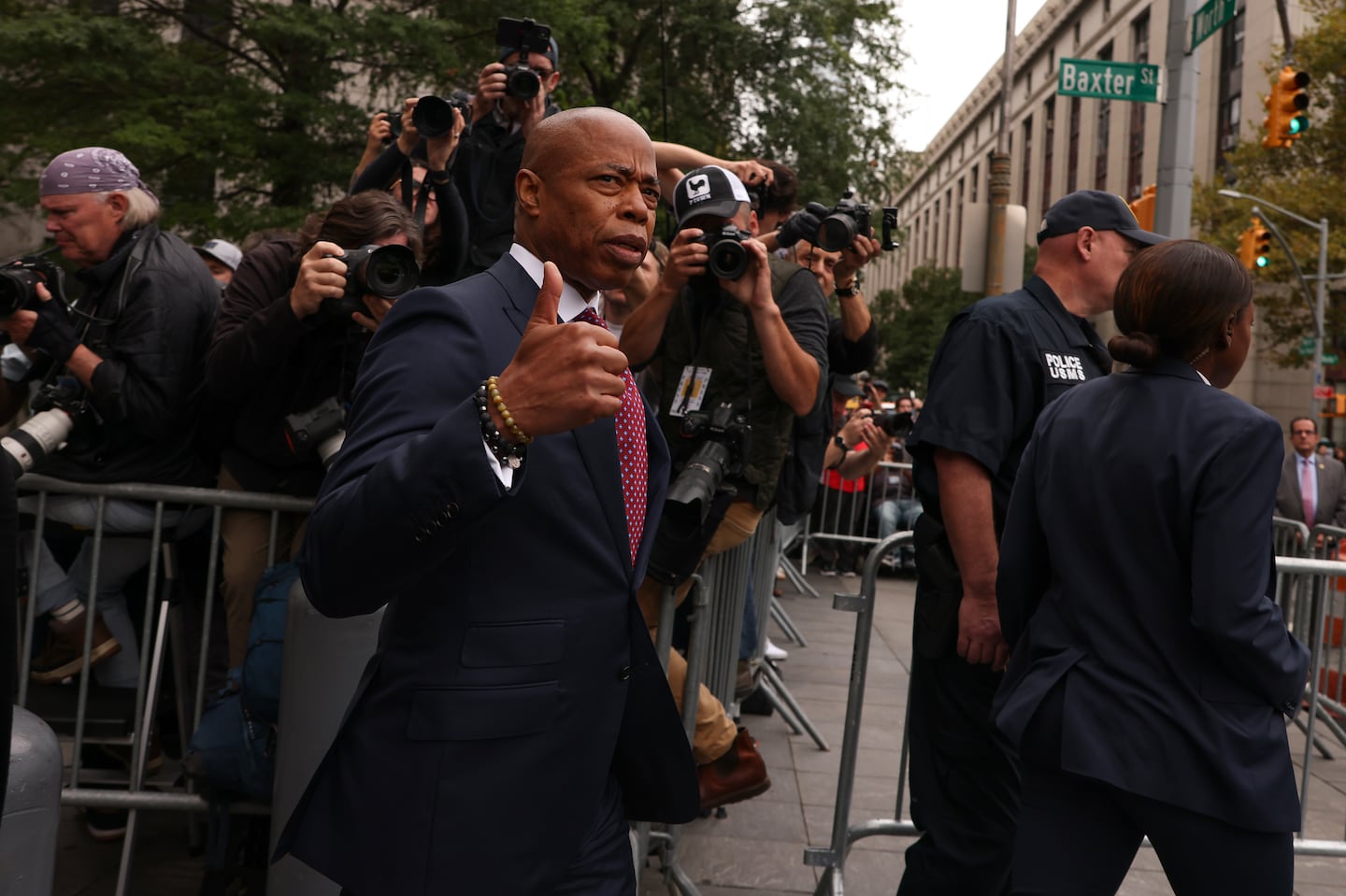 New York City mayor Eric Adams motions as he departs Manhattan federal court, Friday, Sept. 27, 2024, in New York.