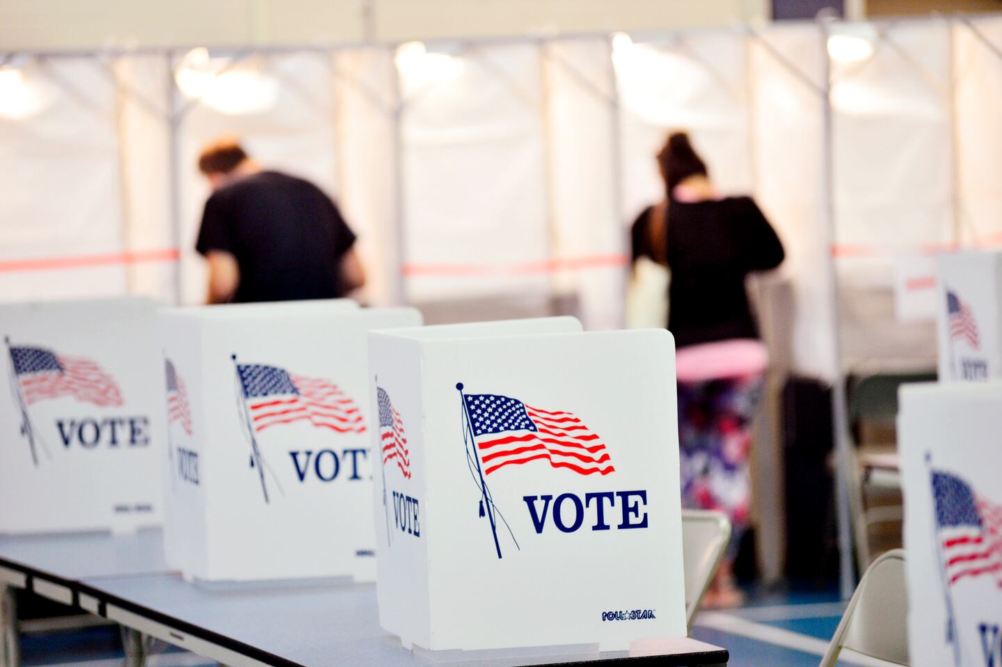 In this Sept. 8, 2020, photo, voting booths are kept socially distant at the Chesterfield, N.H., polling site.