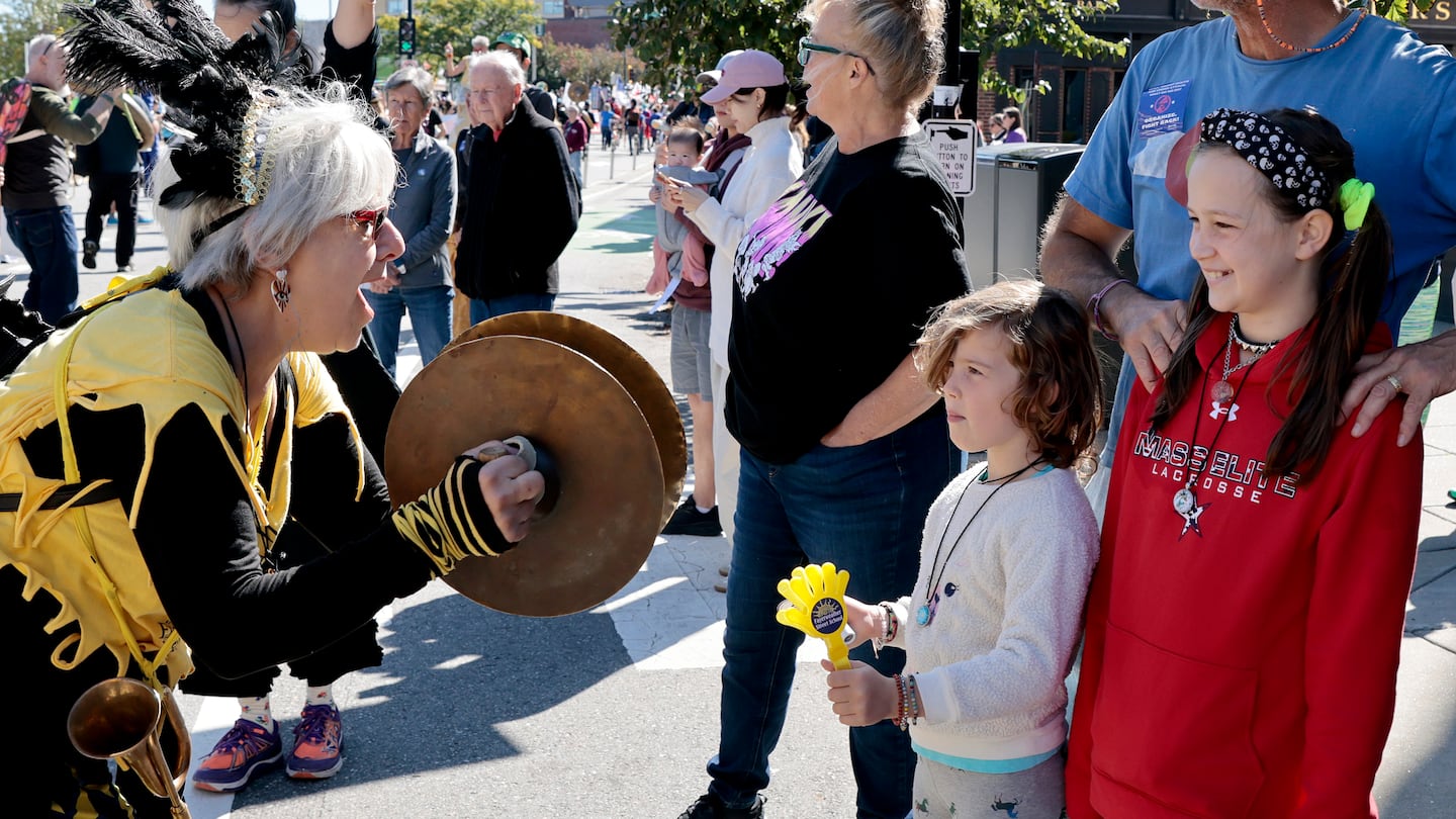 The 2024 edition of the HONK! Festival comes to the Somerville and Cambridge areas Oct. 4-6. Pictured: Attendees watch a performer at the 2023 edition of the outdoor performance weekend.