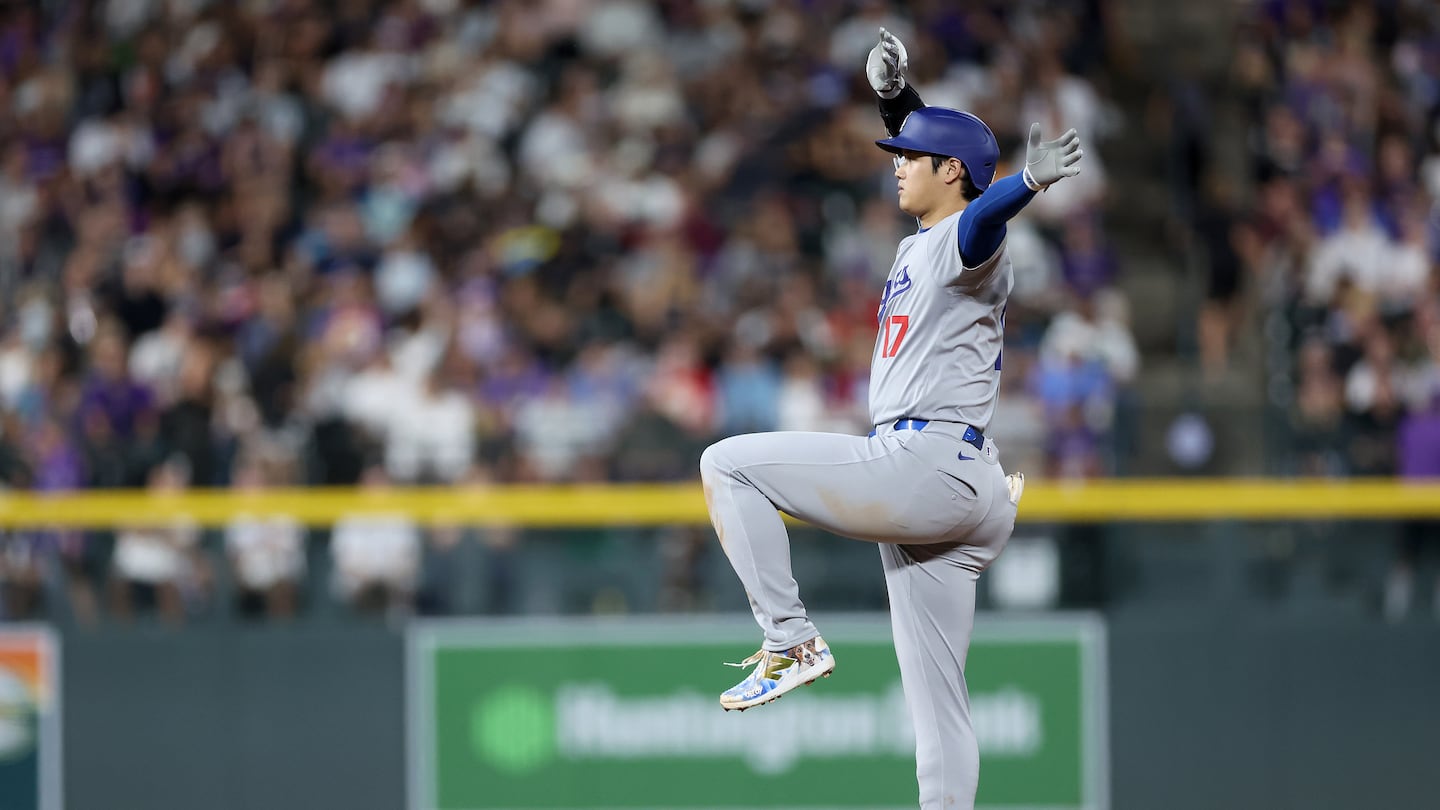 Shohei Ohtani poses on second base after his 57th steal, which set a record for a Japanese-born player.