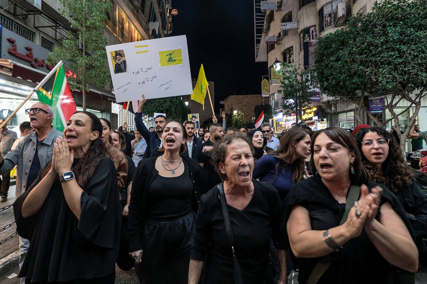 Demonstrators chanted slogans in Ramallah, in the West Bank, on Saturday after Hezbollah leader was killed in an Israeli strike.