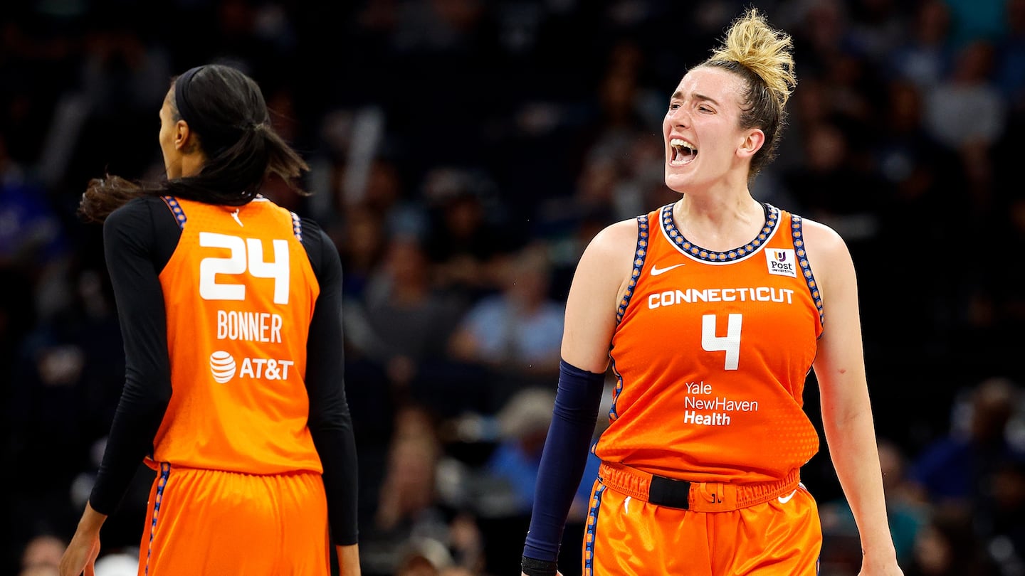 Marina Mabrey (right) celebrates her basket against the Minnesota Lynx. She hit six 3-pointers to lead the Sun.