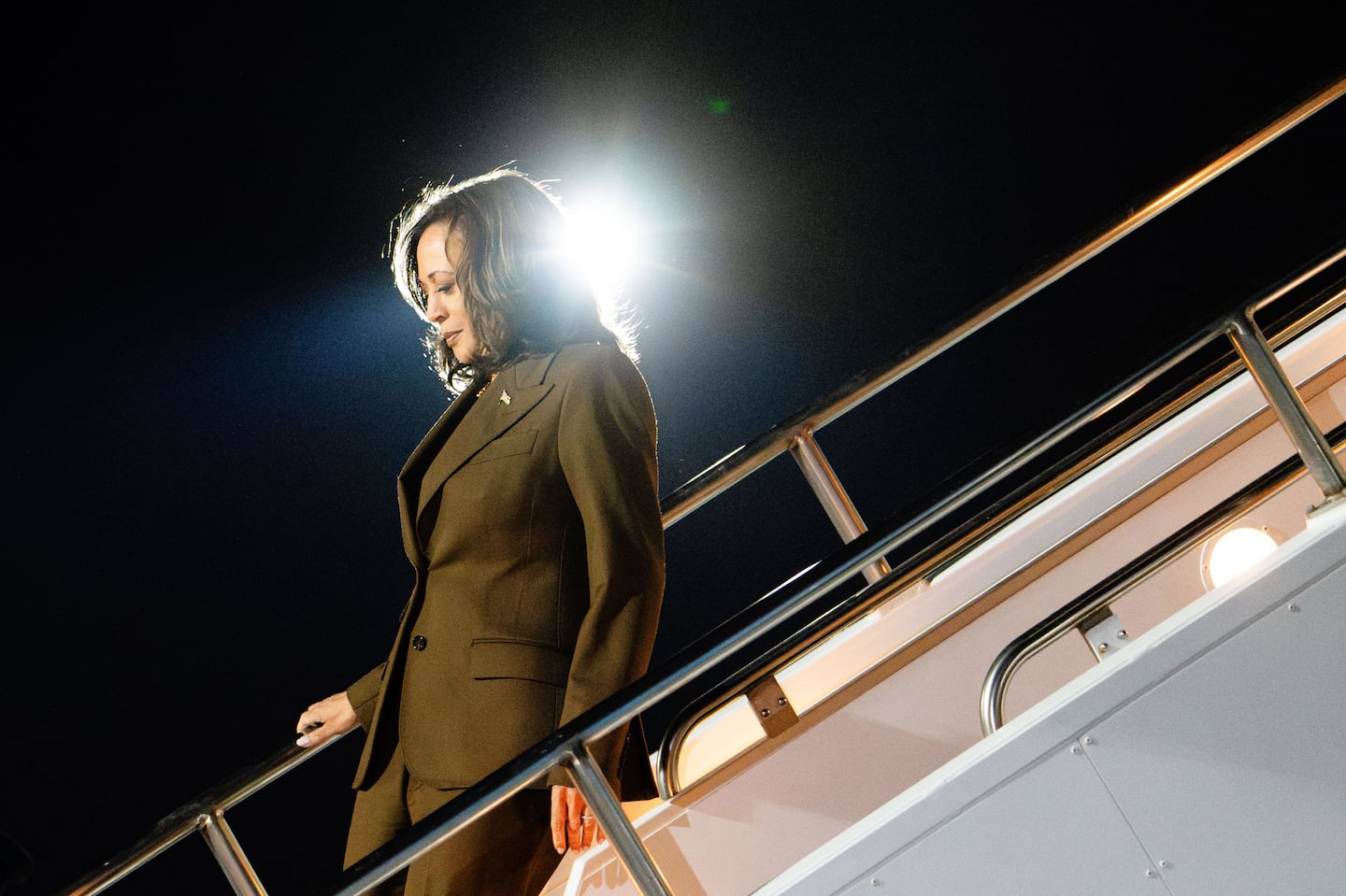 Vice President Kamala Harris descends from Air Force Two upon her arrival in Las Vegas for a campaign rally on Sunday, Sept. 29, 2024.