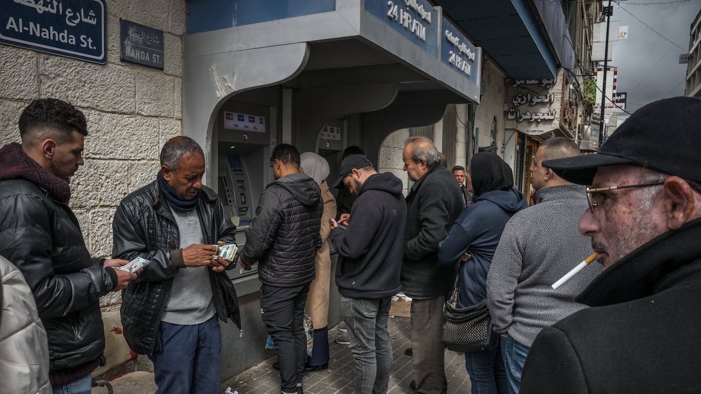 Palestinians lined up this summer at A.T.M.s in Ramallah, in the Israeli-occupied West Bank.