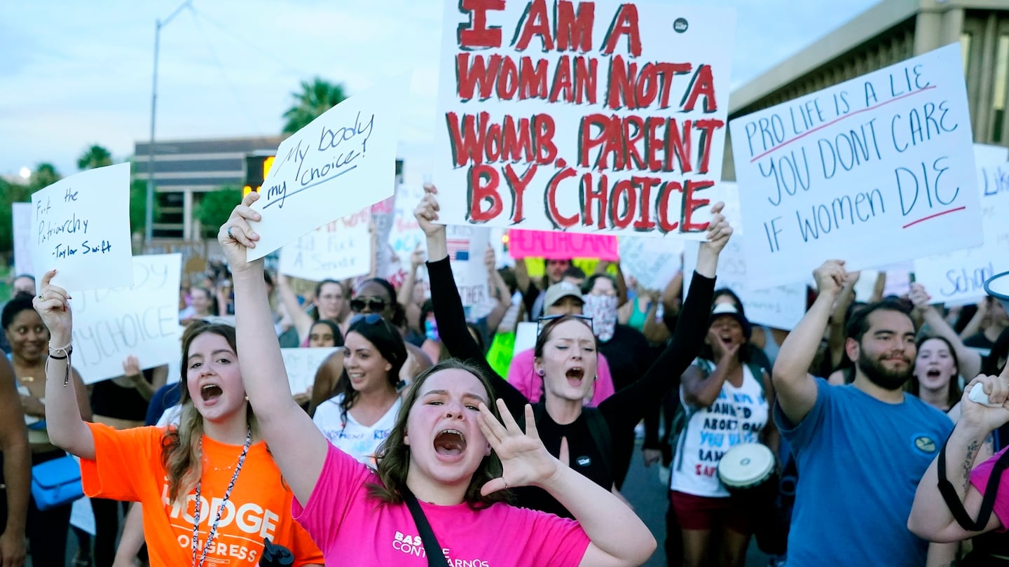 Protesters joined thousands marching around the Arizona Capitol in Phoenix, protesting the US Supreme Court's decision to overturn Roe v. Wade, June 24, 2022.