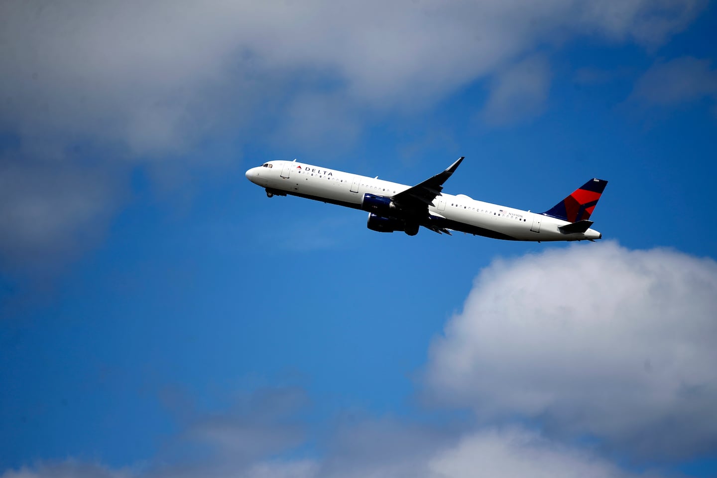 A Delta Air Lines jet takes off from Logan International Airport in June 2022.