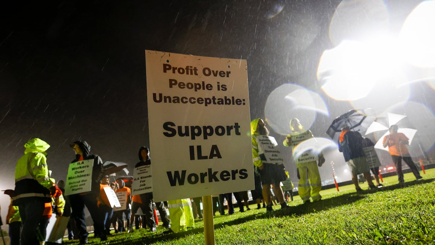 Hundreds of longshoremen strike together outside of the Virginia International Gateway in Portsmouth, Va., on Oct. 1.