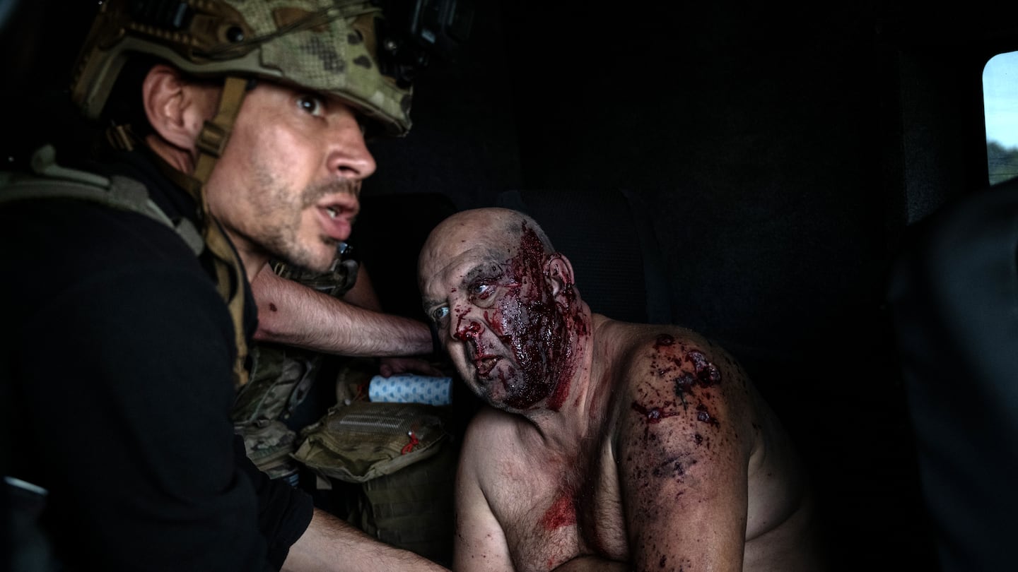 Andriy Khryshtopa, an injured civilian, was assisted by the White Angels evacuation team after a drone struck his car while driving in the village of Kurakhivka, Ukraine, on Thursday. Russian forces appeared to be on the brink of capturing Vuhledar, a shattered mining town that has stood at the intersection of two fronts in the war for nearly three years.