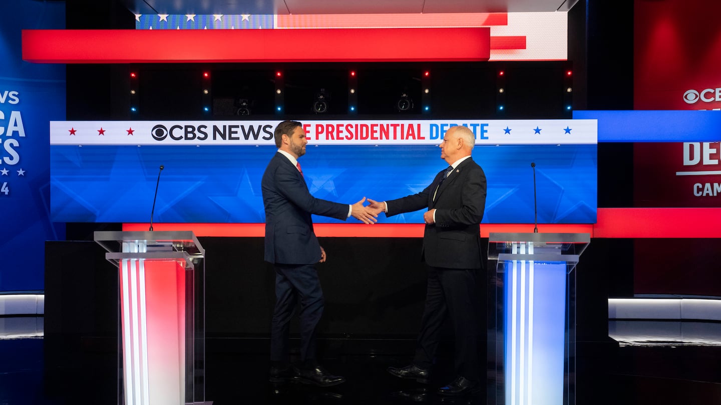 Senator JD Vance and Governor Tim Walz of Minnesota shake hands at the start of the vice-presidential debate at the CBS Broadcast Center in New York on Tuesday, Oct. 1, 2024.