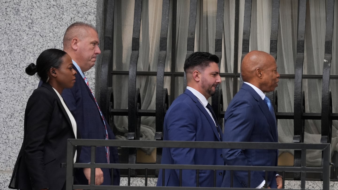 Eric Adams, right, walks into the federal courthouse n New York, Wednesday, Oct. 2, 2024.