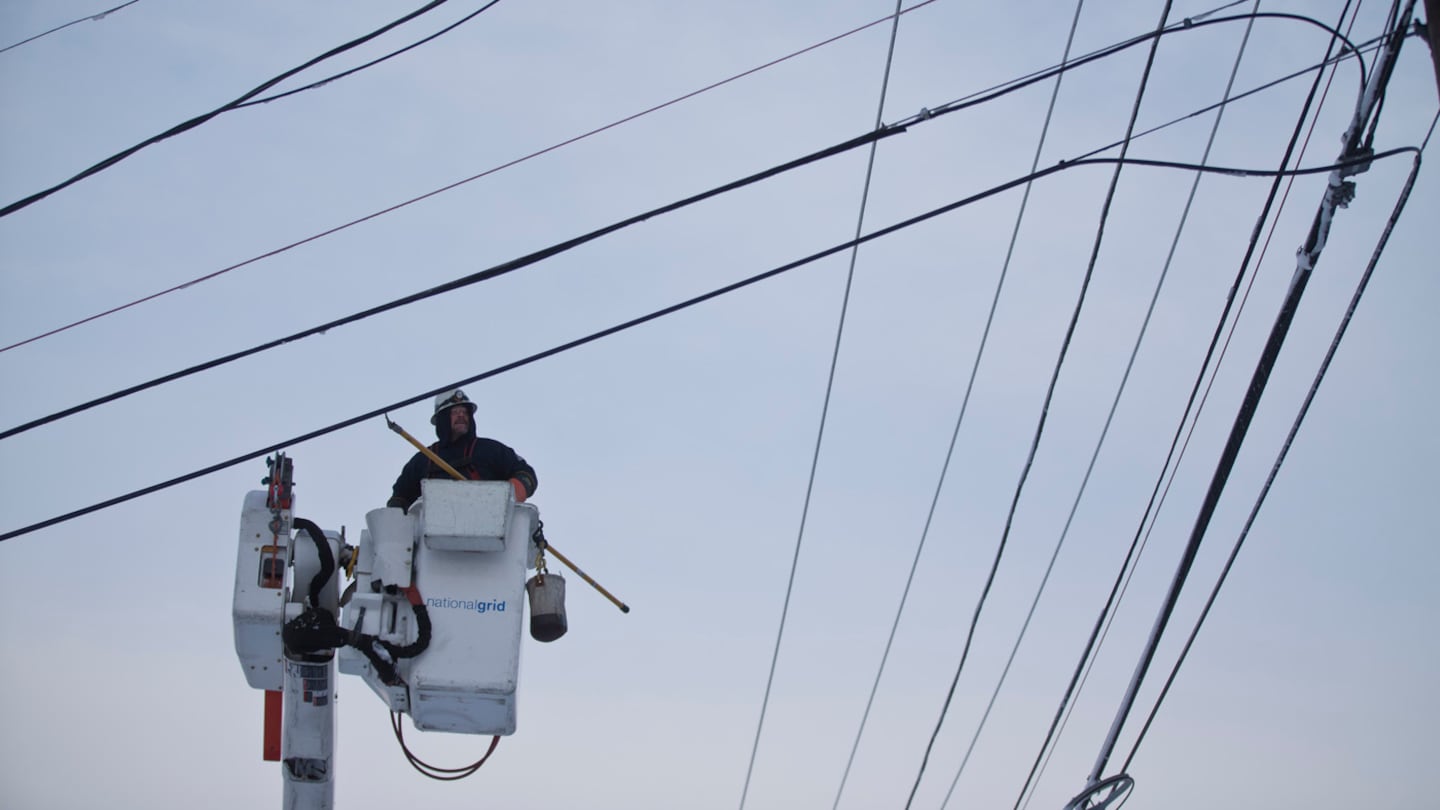 A National Grid utility worker worked on a power line on Washington Steet in Quincy.