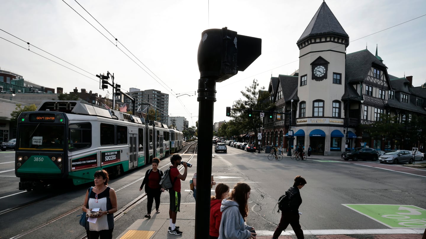 Pedestrians navigate Coolidge Corner in Brookline, MA on September 22, 2023.