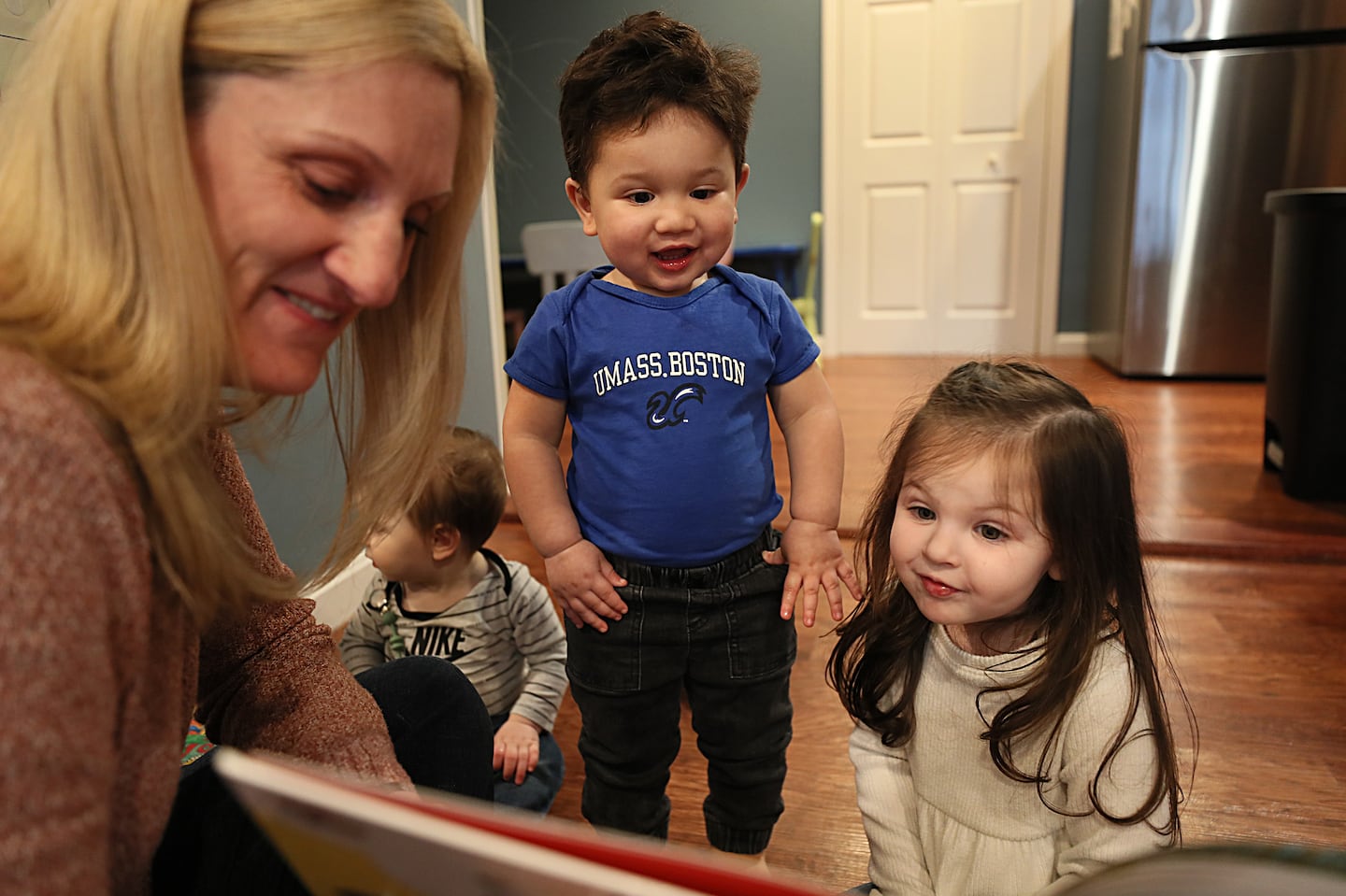 Jennifer Simpson read to the children at her in-home child care center, Brilliant Beginnings Daycare, in Southbridge in April 2024.