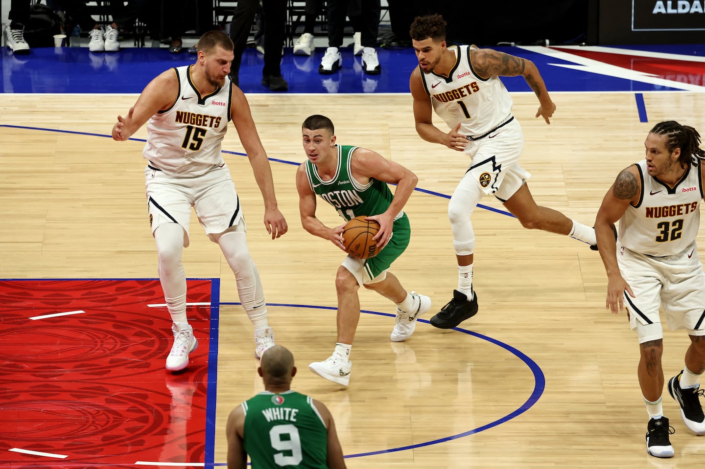 When he wasn't surrounded by Nuggets, Payton Pritchard was hoisting up 3-point attempts; he was 6 of 12 from long range.